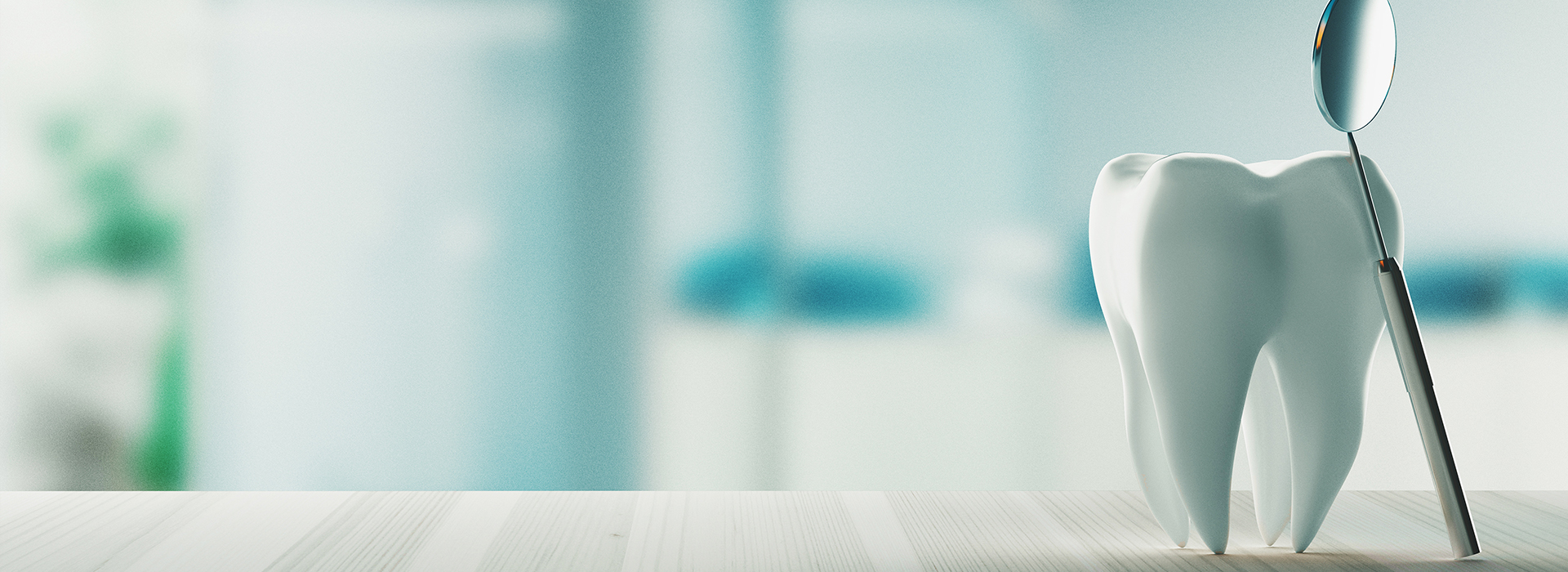 An image of a white toothbrush with bristles, placed on a countertop next to a glass of water.