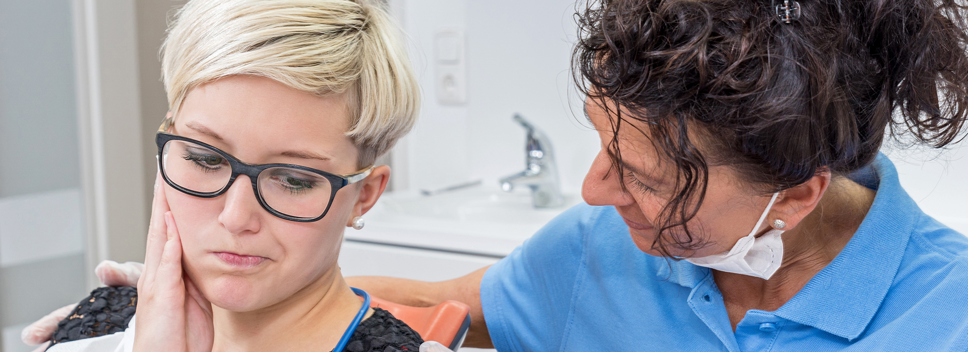 The image shows a side-by-side comparison of a woman receiving dental care and a man performing the dental care, with both individuals wearing protective eyewear.